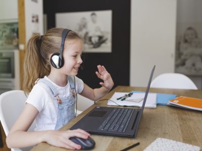 primary school child being tutored online